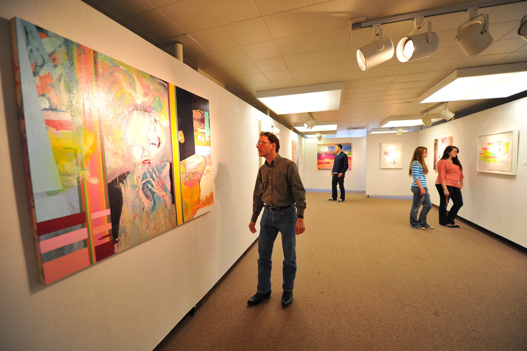 Visitors look at artwork in the Linder Gallery at Keystone College