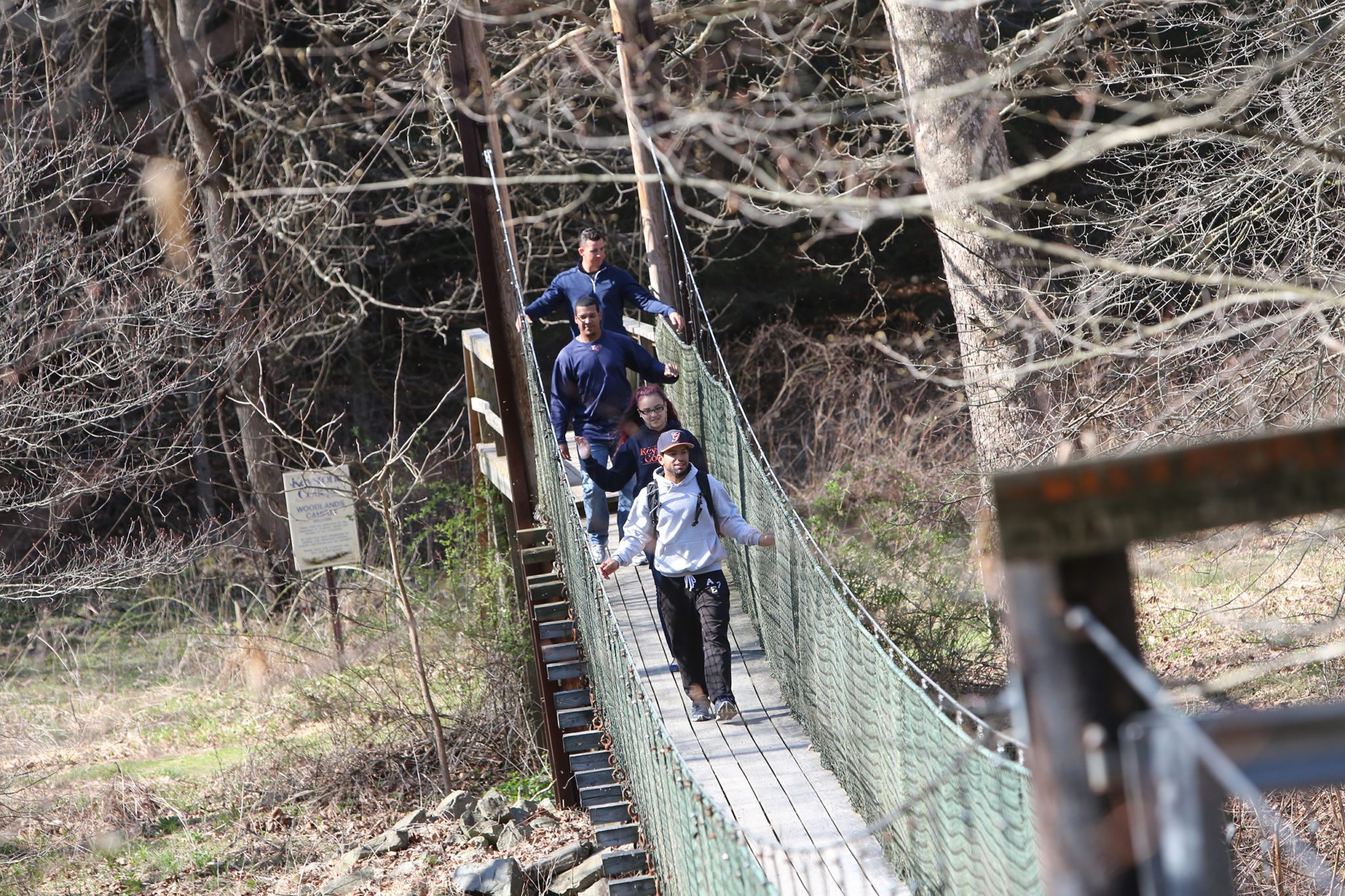 Students cross the suspension bridge at Keystone College