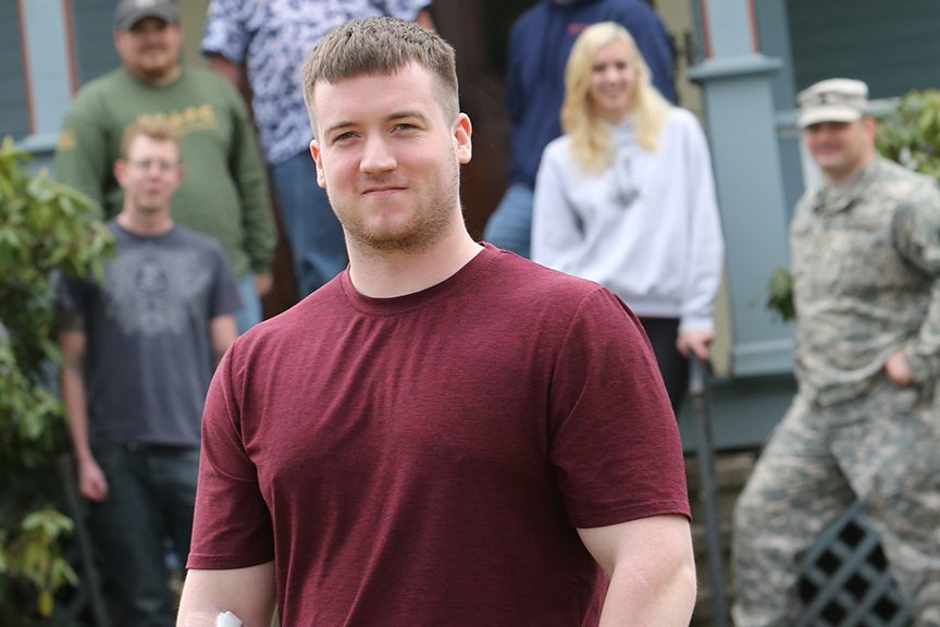 keystone college veteran students stand in front of Veteran Center