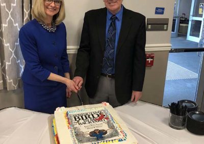 Dr Karen Yarrish and Dave Porter cut a cake