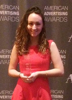 Student Lindsey Lockwood with her Addy Award