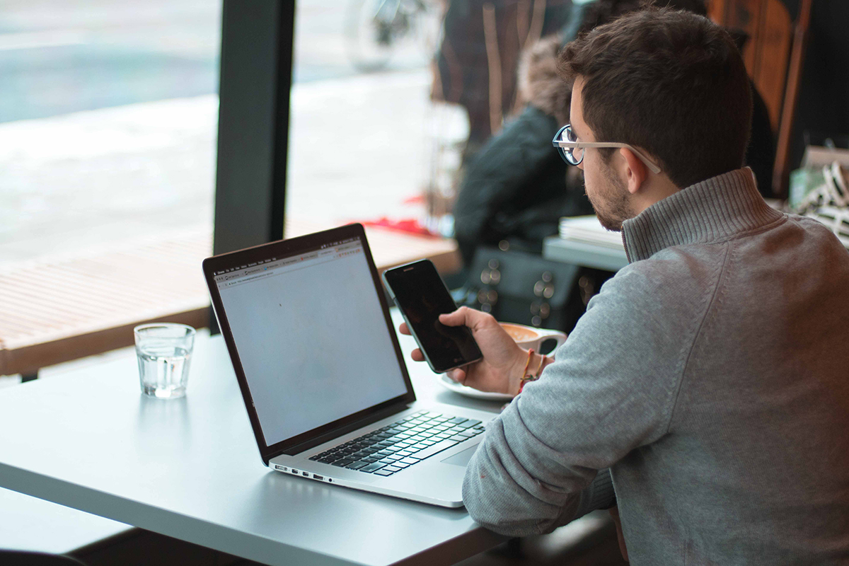 man in cafe on his laptop