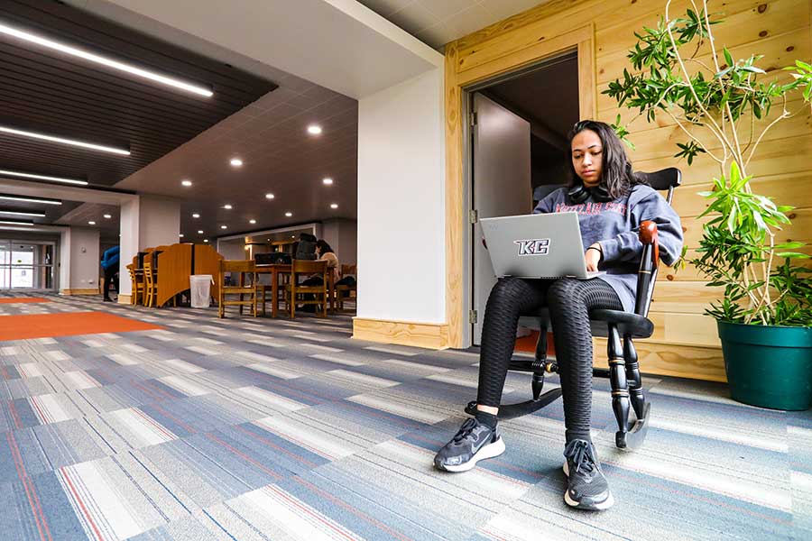 Keystone College Student Studying In Library