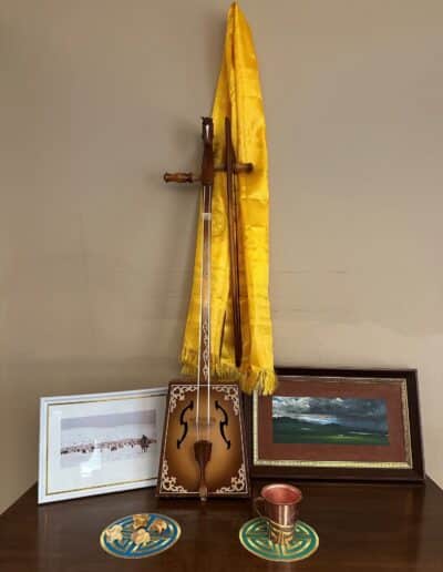 A Morin Khuur, a traditional Mongolian bowed string horsehead instrument, and other items from the National University of Mongolia on display at Keystone College.